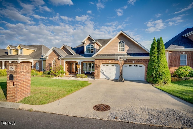 view of front of house featuring a garage and a front lawn