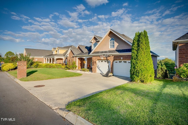 view of front of property featuring a garage and a front yard