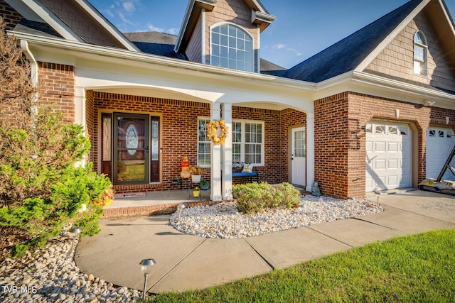 property entrance with a garage and a porch