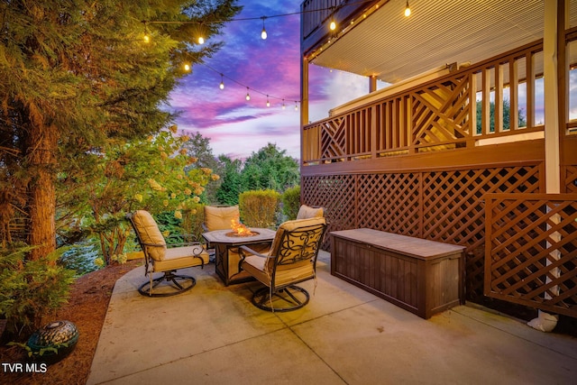 patio terrace at dusk with an outdoor fire pit