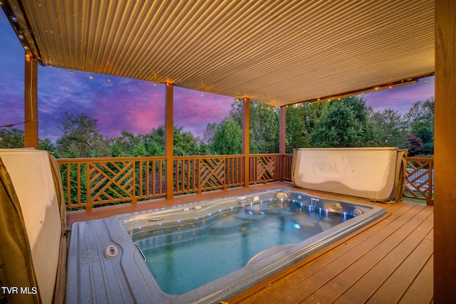 pool at dusk with a deck