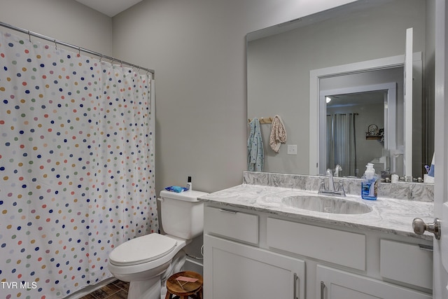 bathroom with vanity and toilet