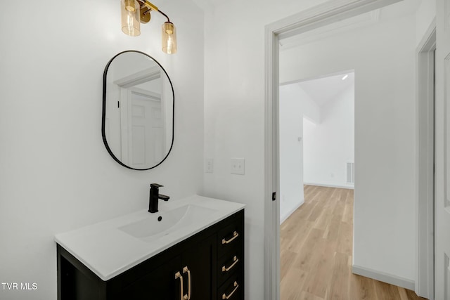 bathroom featuring vanity and wood-type flooring