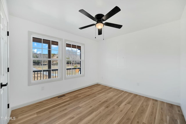 unfurnished room featuring ceiling fan and light wood-type flooring