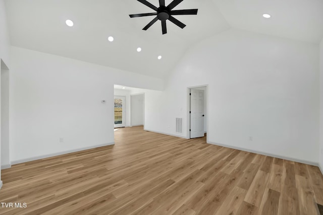 unfurnished living room featuring high vaulted ceiling, ceiling fan, and light wood-type flooring