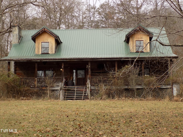 view of front facade featuring a porch and a front yard