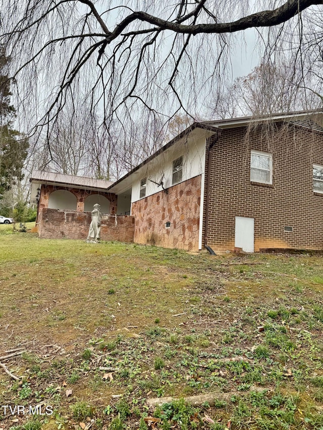 view of property exterior with a yard