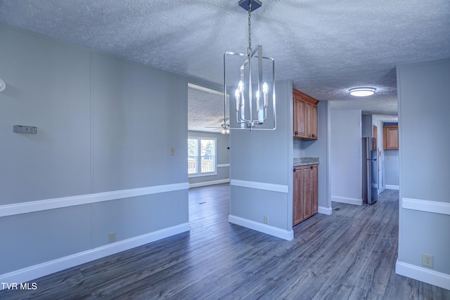 252 Scott Ln, Blountville, TN 37617 - kitchen with dark wood-style flooring, decorative light fixtures, open floor plan, a notable chandelier, and freestanding refrigerator
