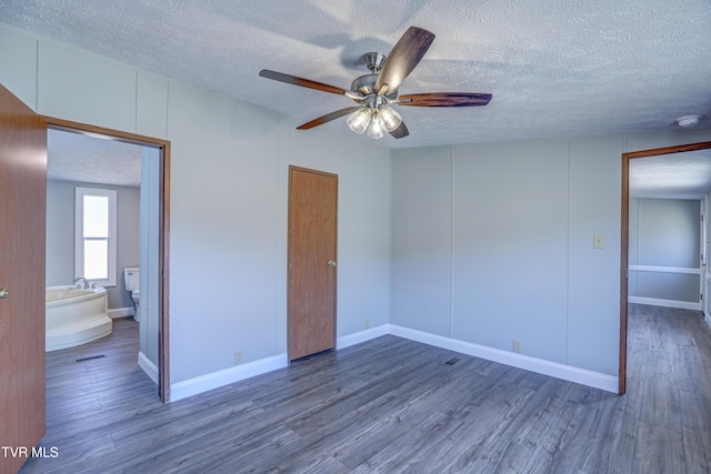 252 Scott Ln, Blountville, TN 37617 - interior space featuring a ceiling fan, a textured ceiling, baseboards, and wood finished floors
