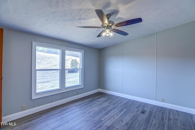 252 Scott Ln, Blountville, TN 37617 - spare room with baseboards, wood finished floors, ceiling fan, and a textured ceiling