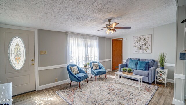 252 Scott Ln, Blountville, TN 37617 - living area with a textured ceiling, baseboards, ceiling fan, and wood finished floors