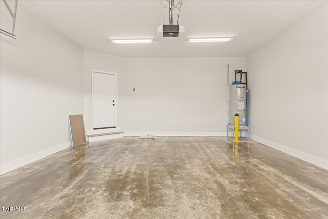 garage featuring a garage door opener and electric water heater