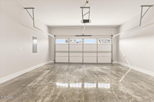 garage with a garage door opener and electric panel