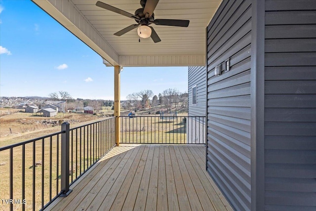 wooden deck with ceiling fan