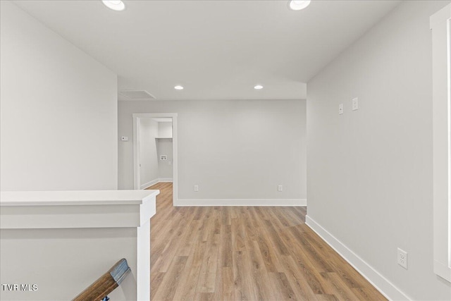 corridor featuring light wood-type flooring