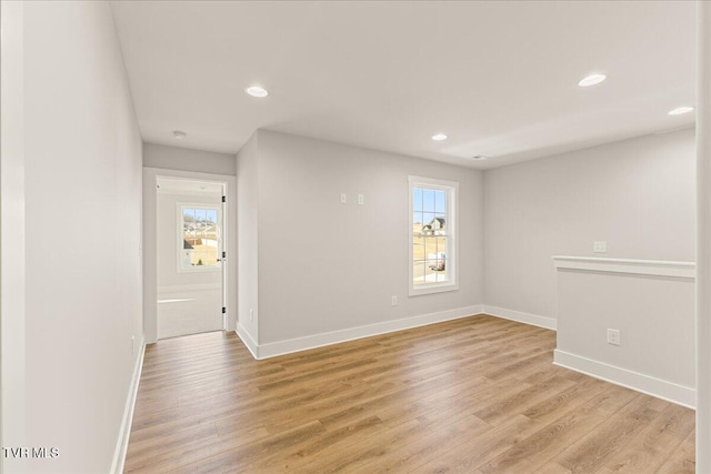 unfurnished room featuring light wood-type flooring