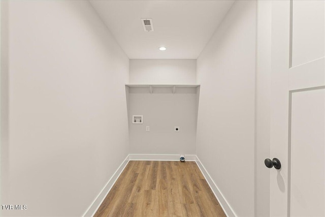 laundry area with washer hookup, hardwood / wood-style floors, and electric dryer hookup