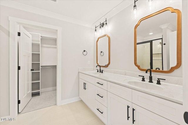 bathroom featuring ornamental molding, vanity, and a shower with door