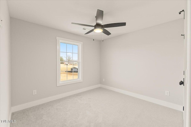 carpeted empty room with ceiling fan