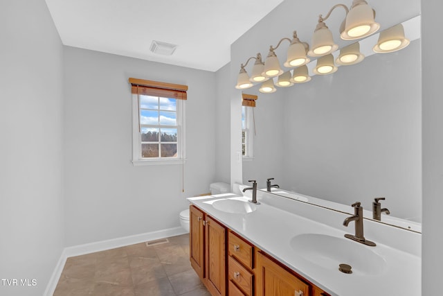 bathroom with vanity and toilet