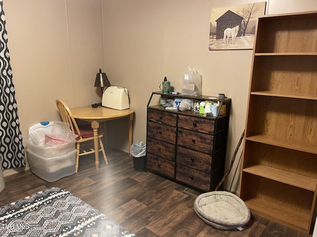 home office with dark hardwood / wood-style flooring