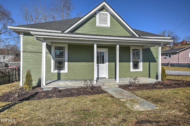 bungalow-style home with a porch and a front yard