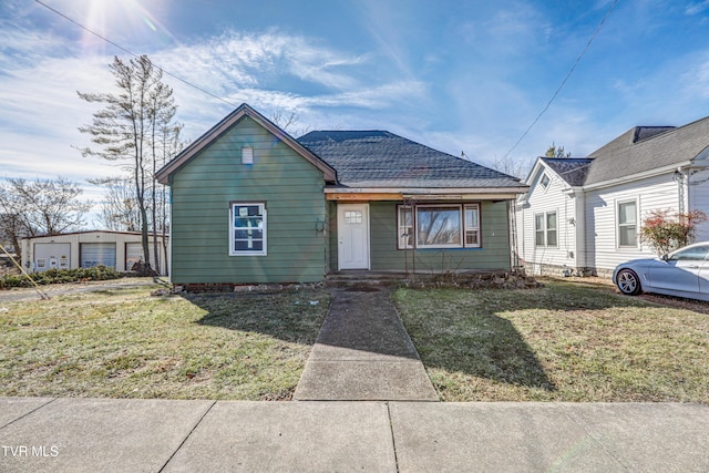 bungalow-style house with a front yard