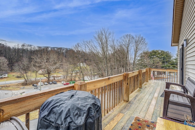 wooden deck with area for grilling