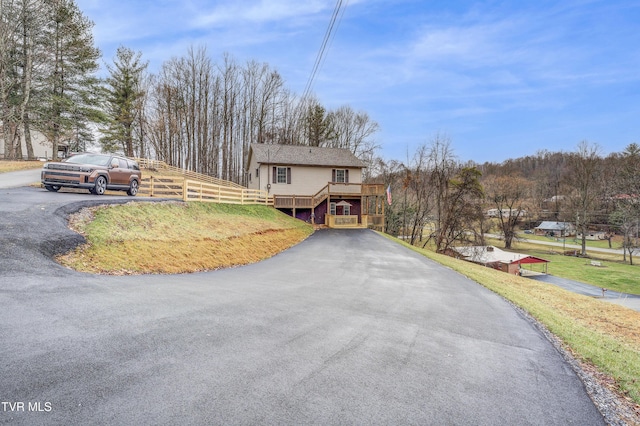 front of property featuring a wooden deck