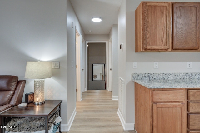 hallway featuring light hardwood / wood-style flooring