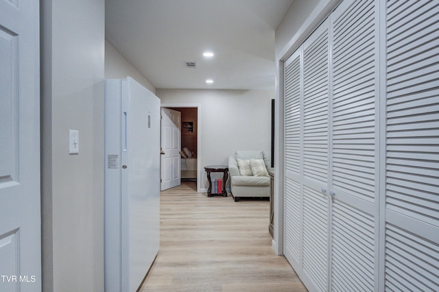 hall featuring light hardwood / wood-style floors