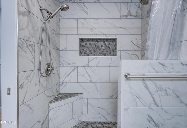 bathroom featuring walk in shower