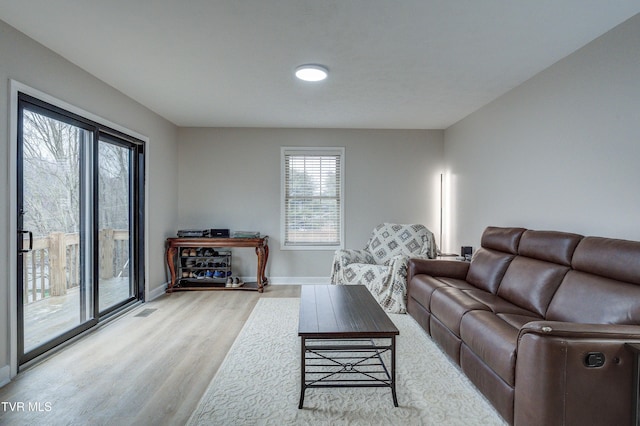 living room with light hardwood / wood-style floors