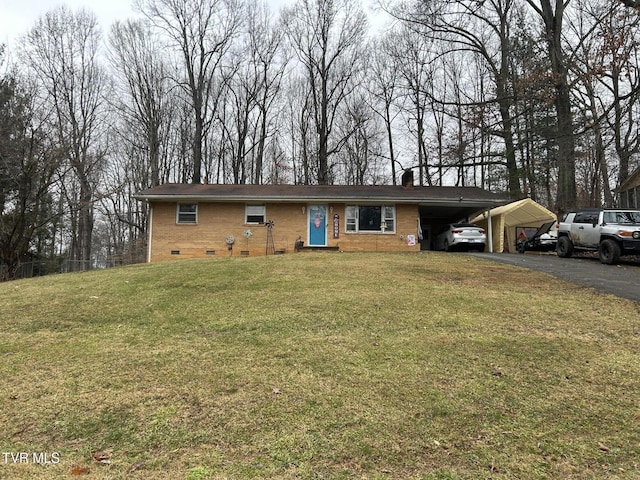 single story home with a front lawn and a carport