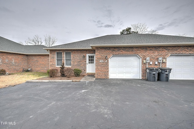 ranch-style home with a garage