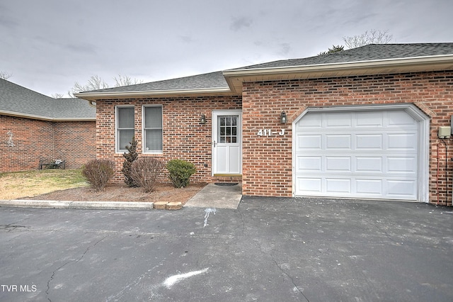 single story home featuring a garage