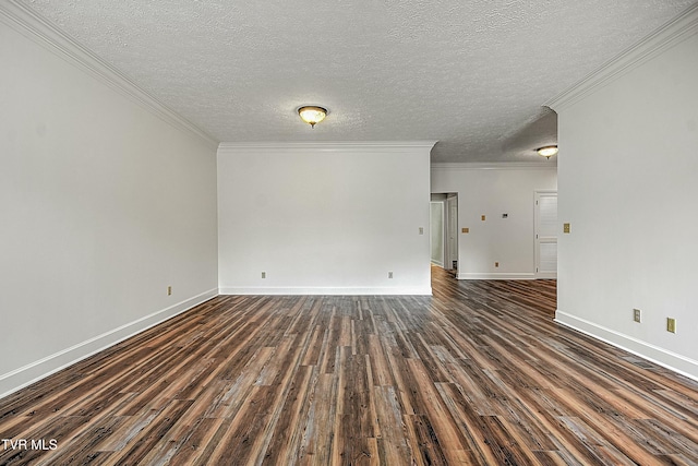 empty room with ornamental molding, dark hardwood / wood-style floors, and a textured ceiling