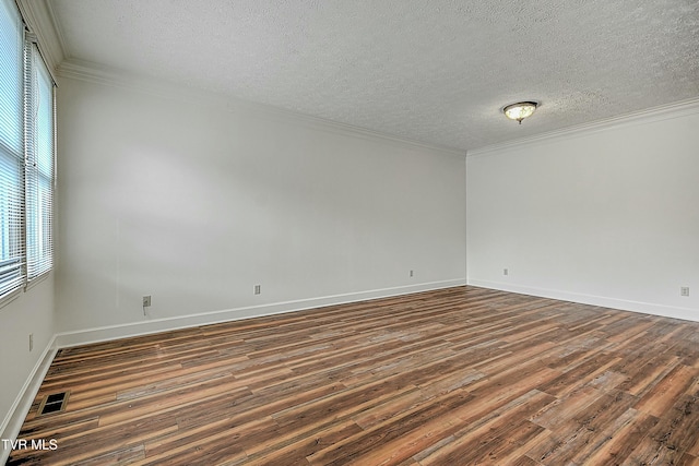 unfurnished room with crown molding and dark hardwood / wood-style flooring