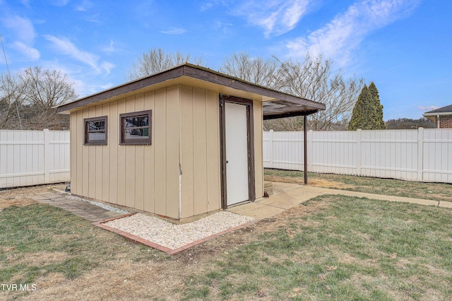 view of outbuilding with a lawn