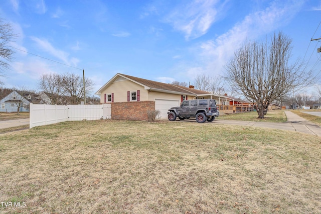 view of property exterior featuring a garage and a yard