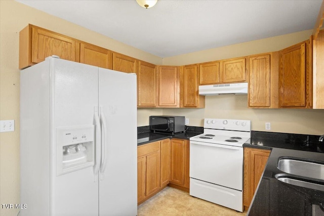 kitchen featuring sink and white appliances