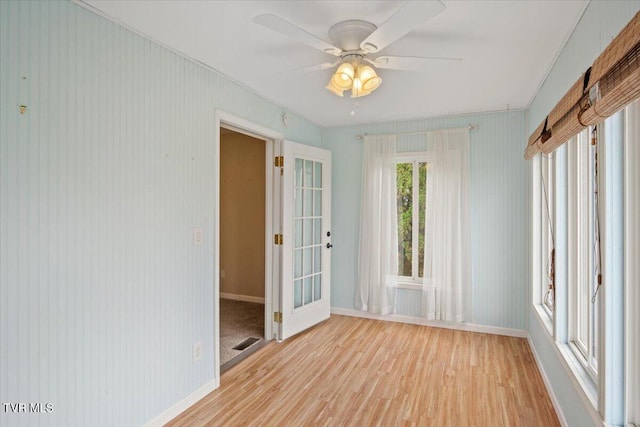 spare room with ceiling fan and light hardwood / wood-style flooring