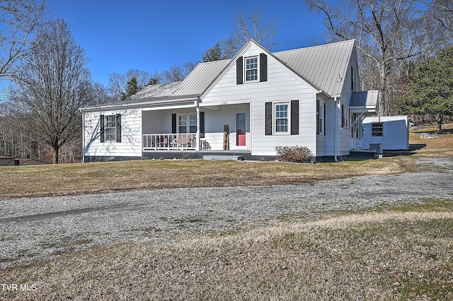 view of front of house with a front yard and covered porch