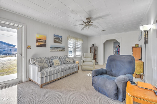 living room with carpet floors and ceiling fan