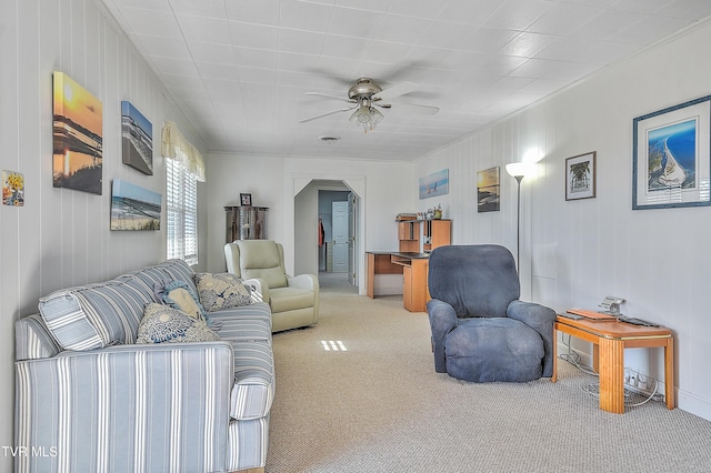 carpeted living room featuring ceiling fan