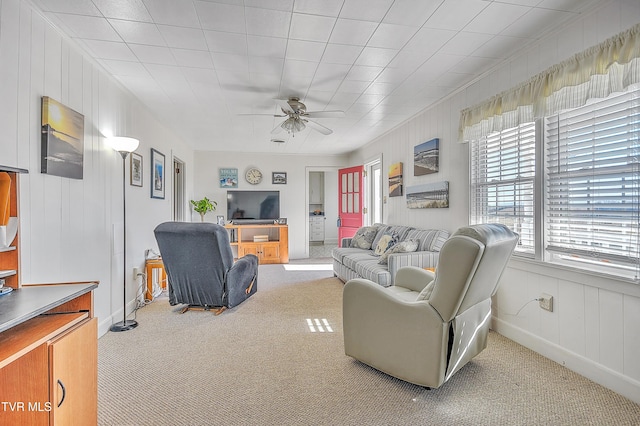 living room with ceiling fan and carpet flooring