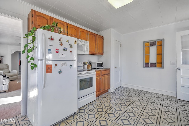 kitchen with white appliances and ornamental molding