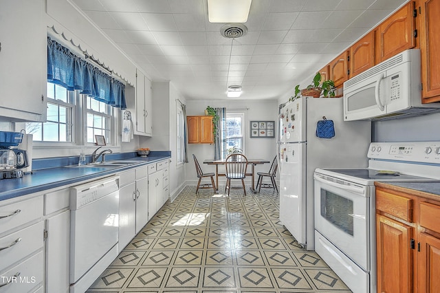 kitchen with sink and white appliances