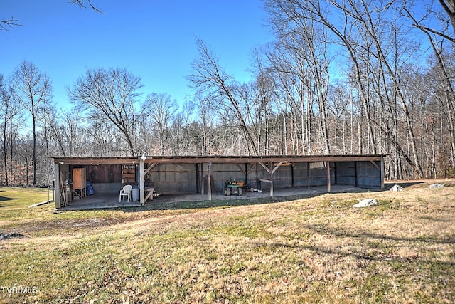 view of outbuilding with a lawn