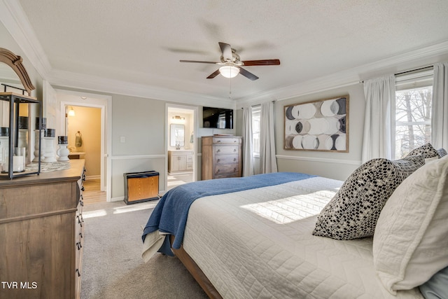 bedroom featuring multiple windows, light carpet, ornamental molding, and a textured ceiling